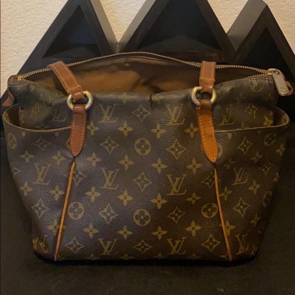 Louis Vuitton bag/Fair condition/Extensive damage/Was a gift back in 2013